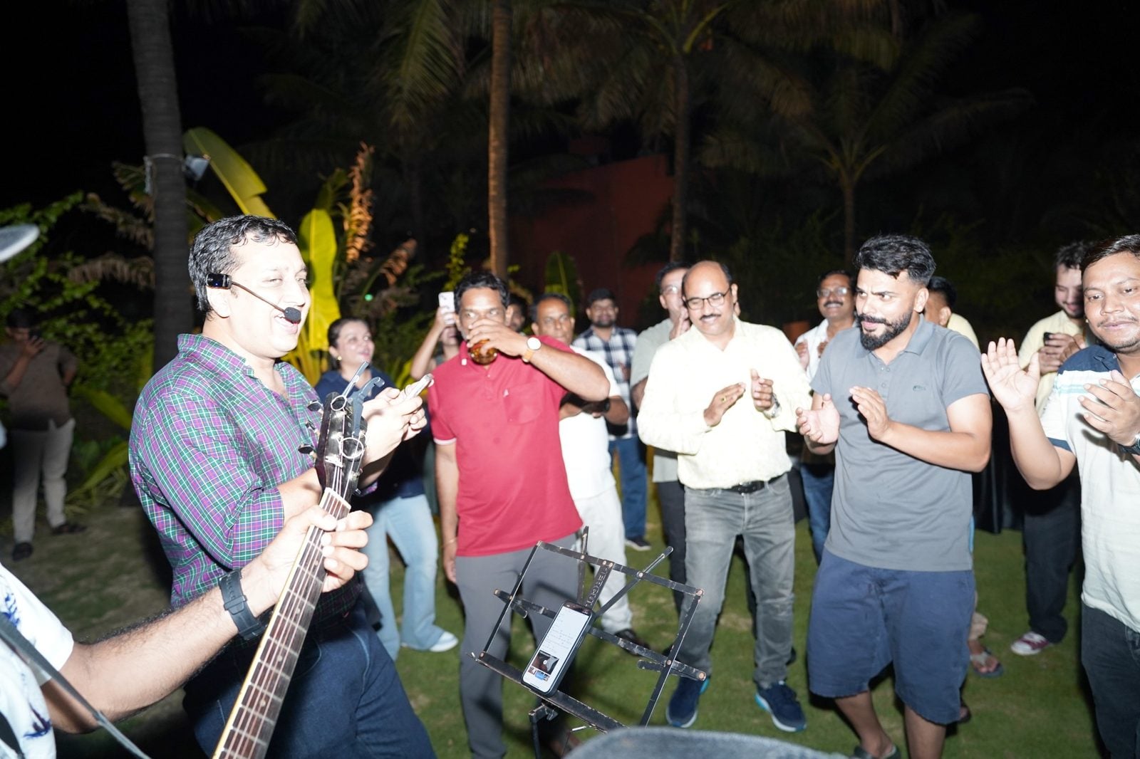Partners clapping along with the band
