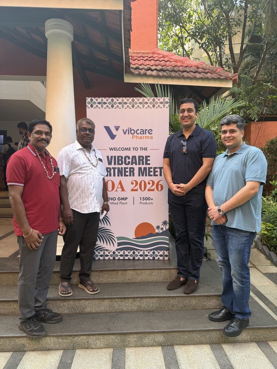 A Vibcare partner with the Vibcare team at the welcome standee