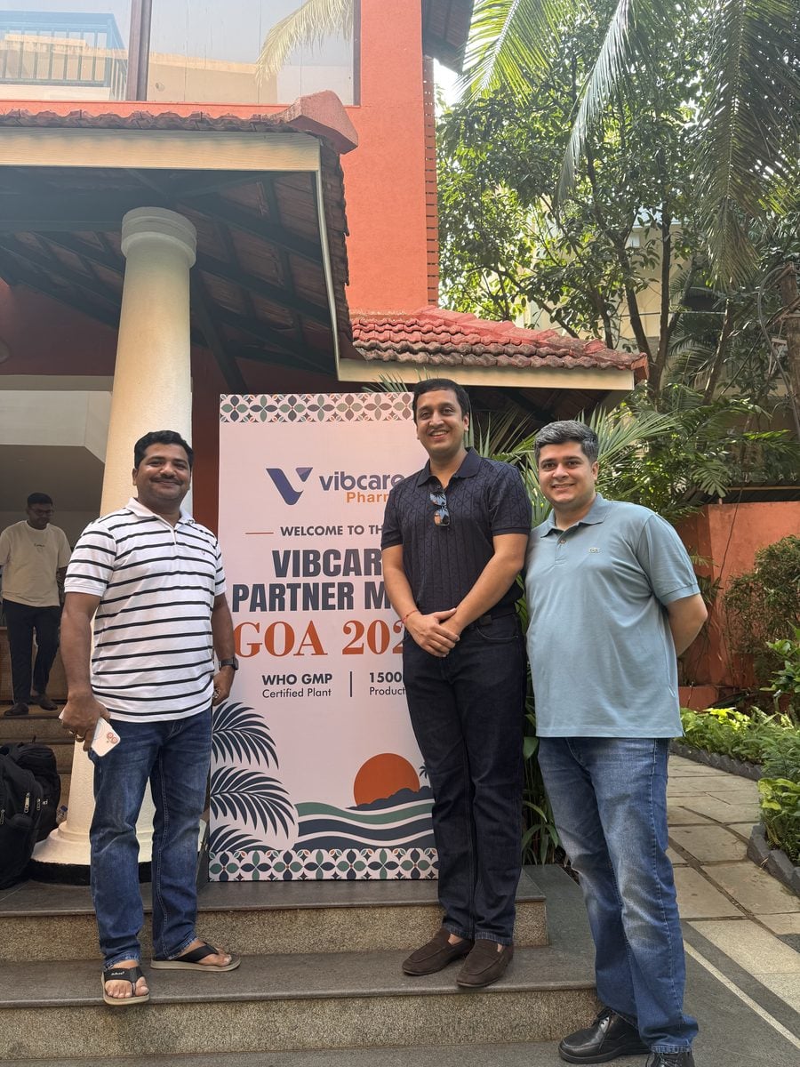 A Vibcare partner with the Vibcare team at the welcome standee