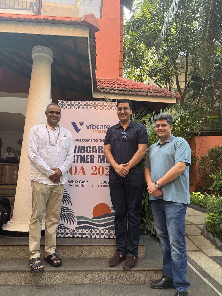 A Vibcare partner with the Vibcare team at the welcome standee