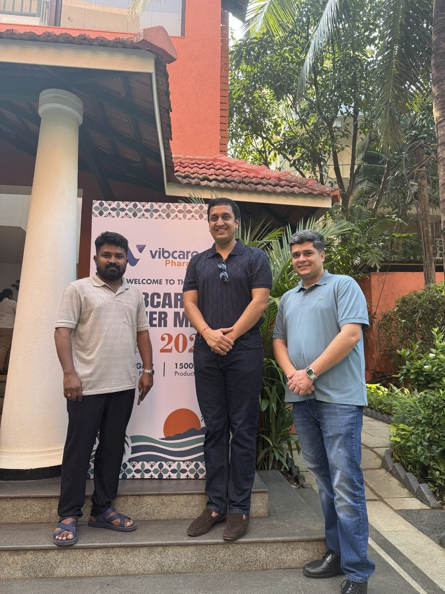A Vibcare partner with the Vibcare team at the welcome standee