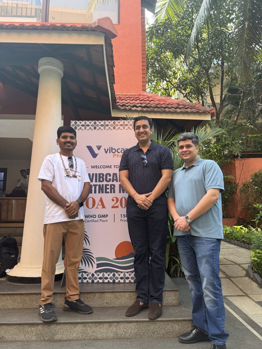 A Vibcare partner with the Vibcare team at the welcome standee