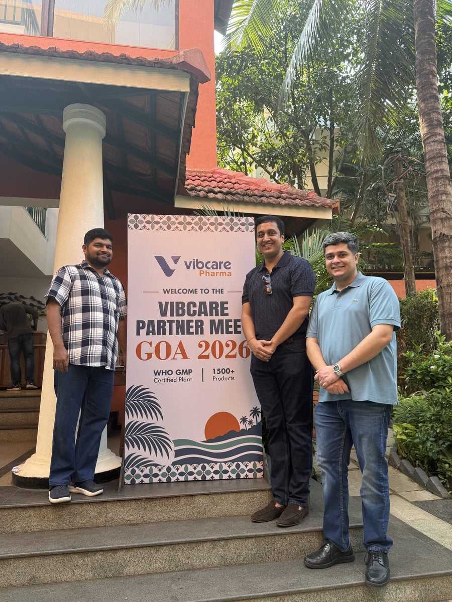 A Vibcare partner with the Vibcare team at the welcome standee
