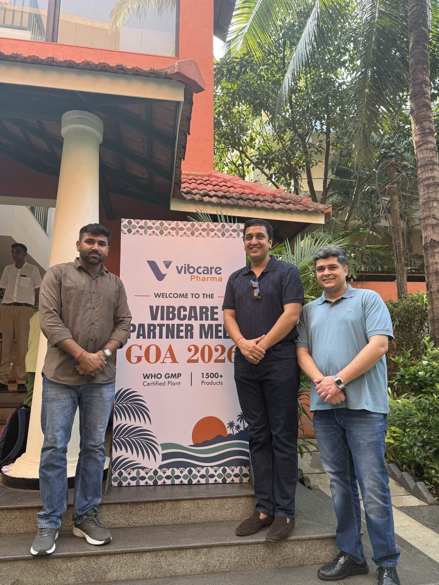 A Vibcare partner with the Vibcare team at the welcome standee